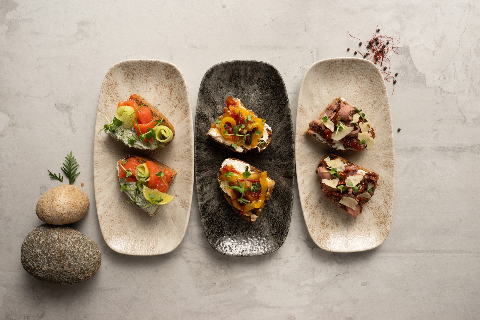 Selection of plated dishes on a rustic table